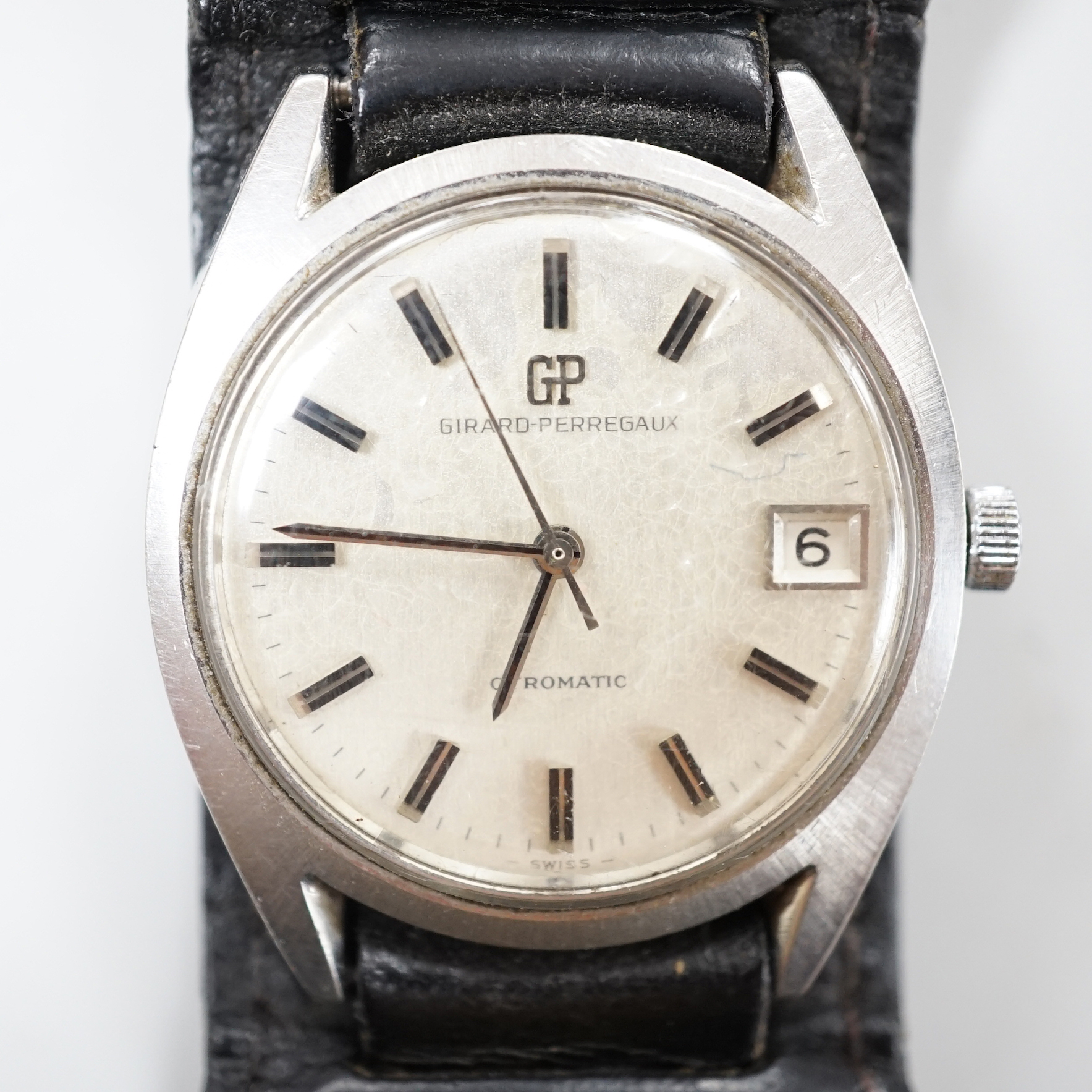 A gentleman's steel Girard Perregaux Gyromatic wrist watch, with original box and guarantee dated 1971